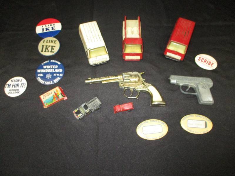 lot 181 image: Antique Gene Autry Revolver, Colt Cap gun, Old Buttons, Tonka Metal Firetruck and antique collector vans, ambulence