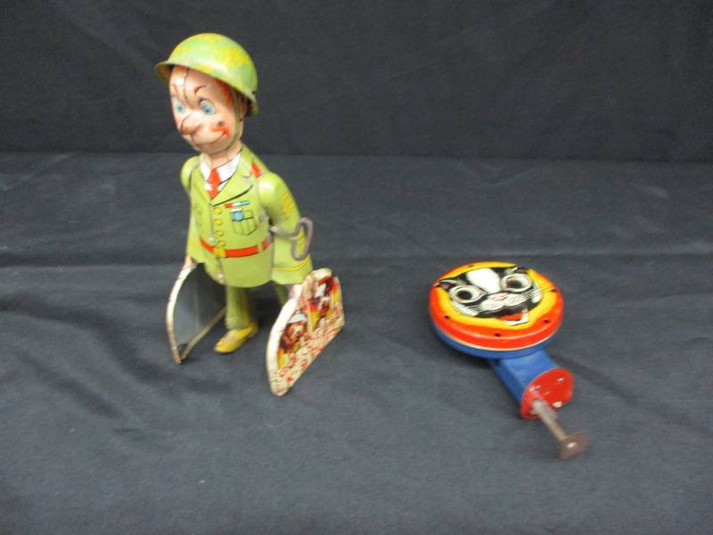 lot 182 image: GI Joe K-9 Pup GI-Joe walks along and works and his feet move as he carries his pups. Article inside of his leg and other antique collectible toy Cat