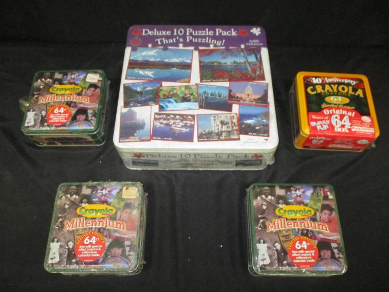 lot 200 image: Tins full of crayons and puzzles unopened