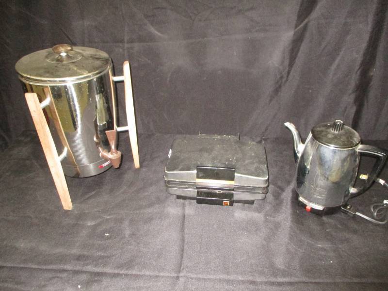lot 205 image: Coffee Pops and Waffle iron Cords inside