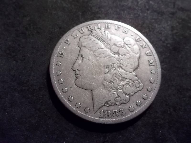 lot 2 image: 1883 CC Morgan Silver Dollar