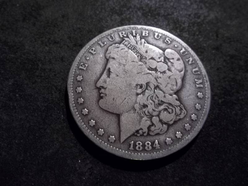 lot 17 image: 1884 S Morgan Silver Dollar