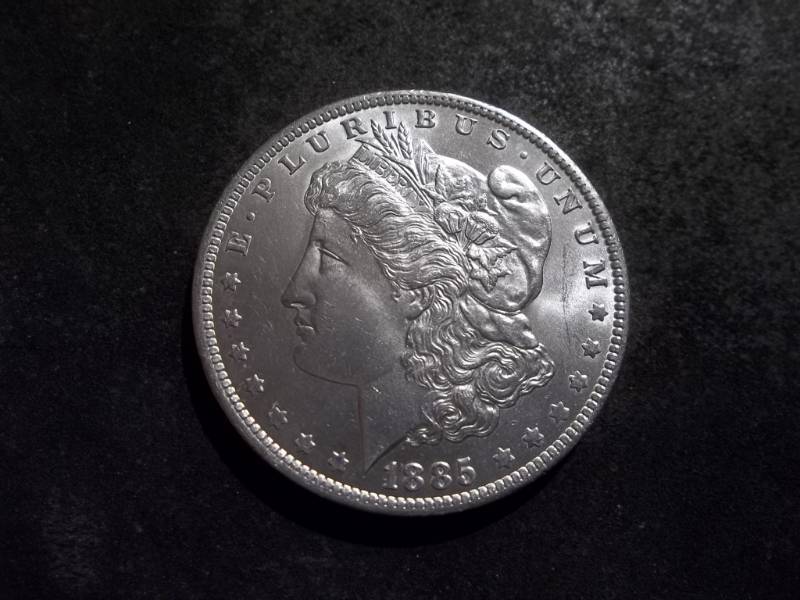 lot 19 image: 1885 O Morgan Silver Dollar