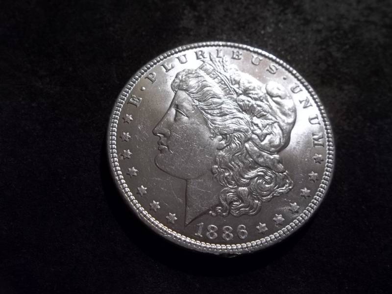lot 21 image: 1886 Morgan Silver Dollar