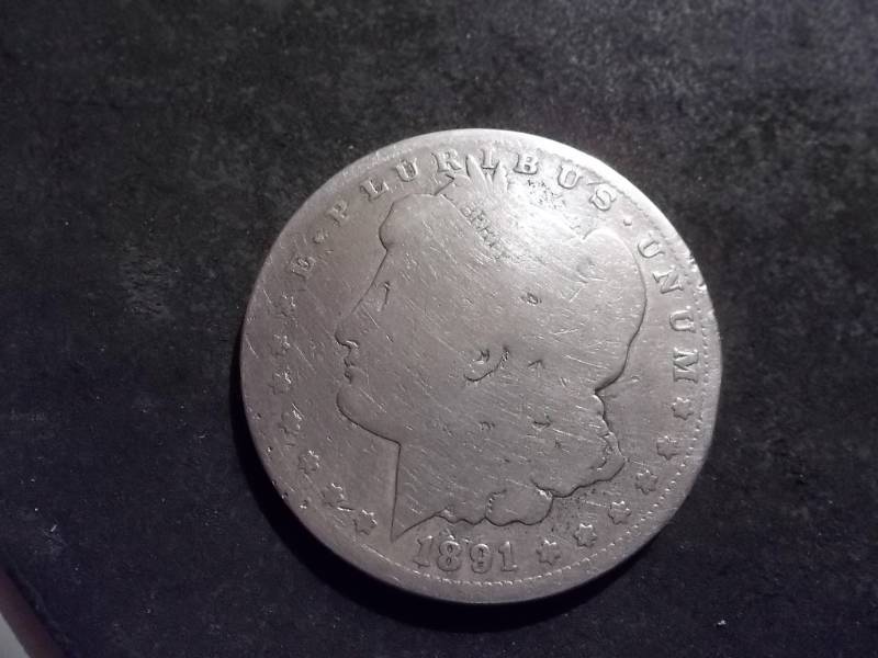 lot 25 image: 1891 CC Morgan Silver Dollar