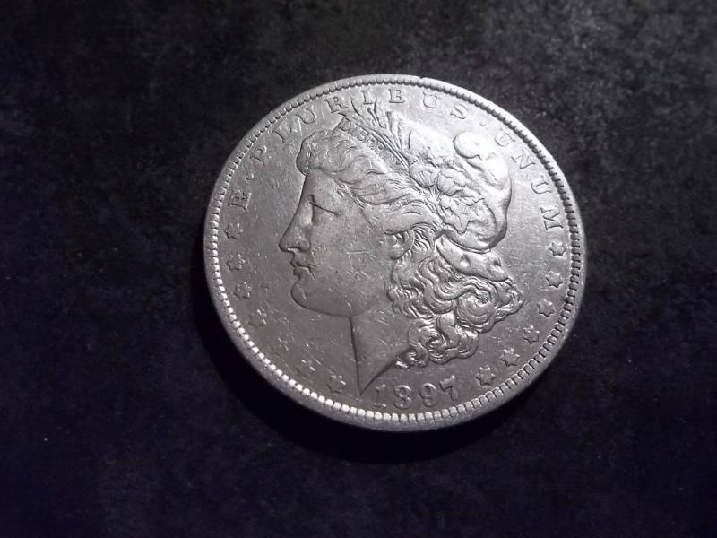 lot 27 image: 1897 O Morgan Silver Dollar