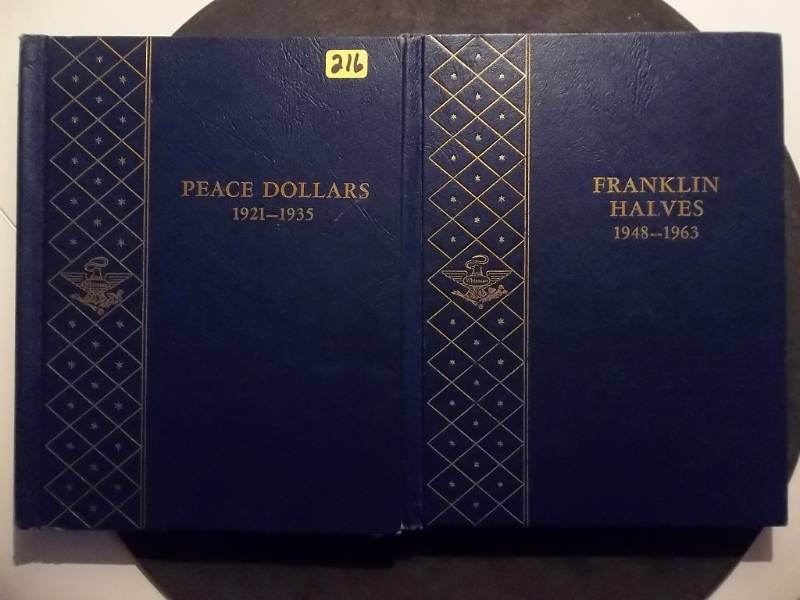 lot 216 image: 2-Whitman Collector Coin Albums Franklin Half Dollars & Peace Silver Dollars Both With Protective Sliders