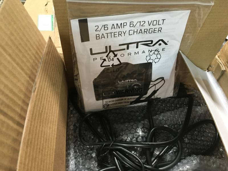 lot 58 image: Ultra Performance 26 Amp 612-Volt Manual Battery Charger open box in like new condition
