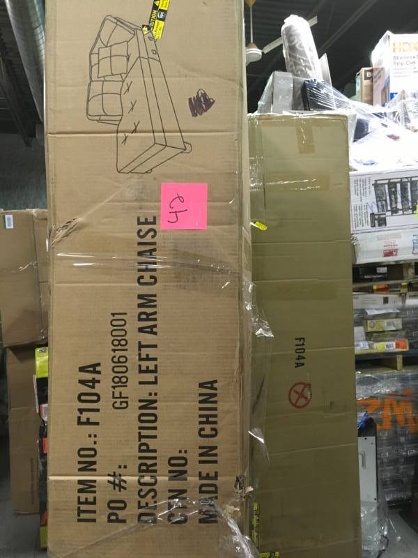 lot 42 image: Red Left Chaise Sectional with Storage Ottoman not used