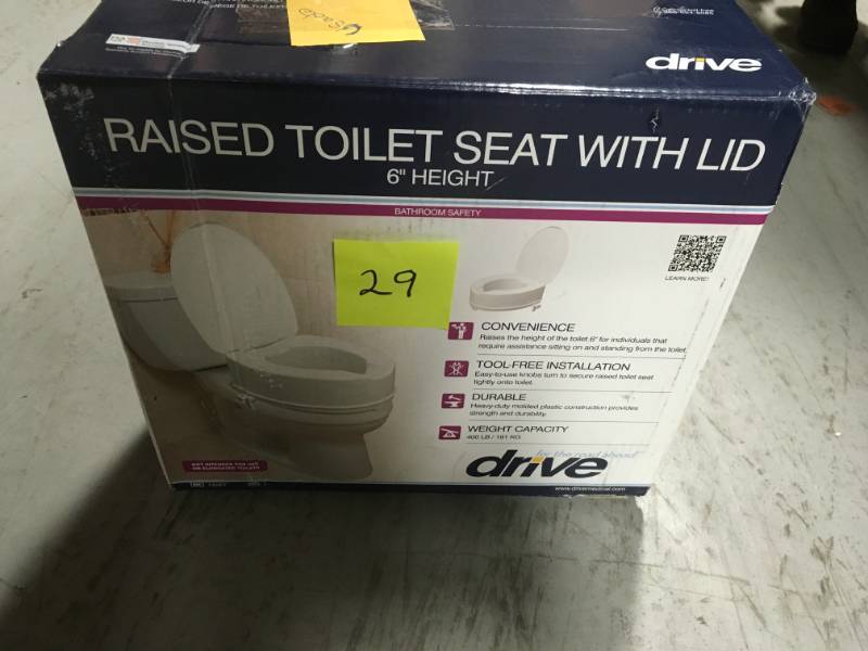 lot 29 image: Drive Raised Toilet Seat with Lock and Lid USED in good condition