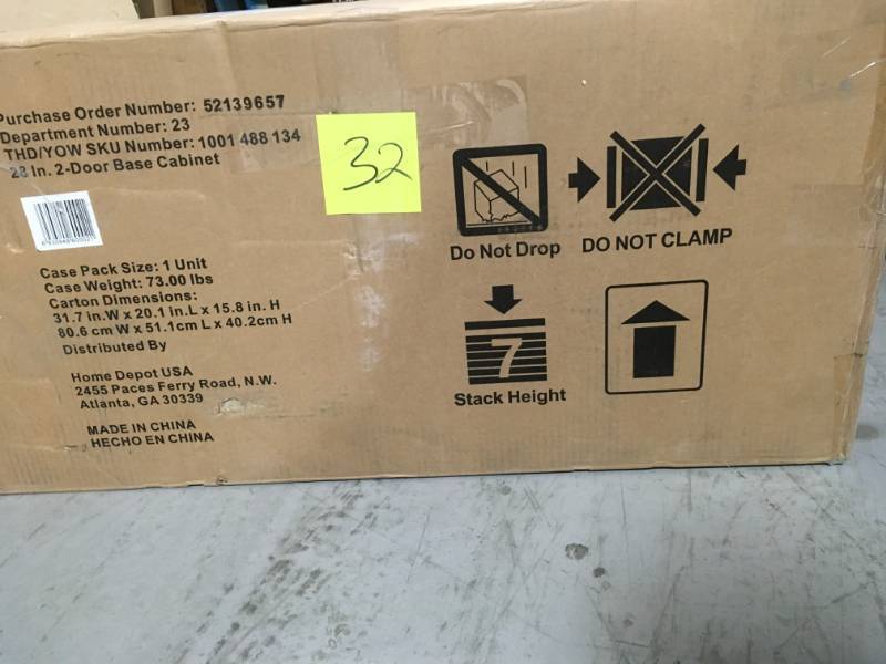 lot 32 image: Husky 32 in. H x 28 in. W x 18 in. D 2 Door Steel Garage Base Cabinet  open box in like new condition