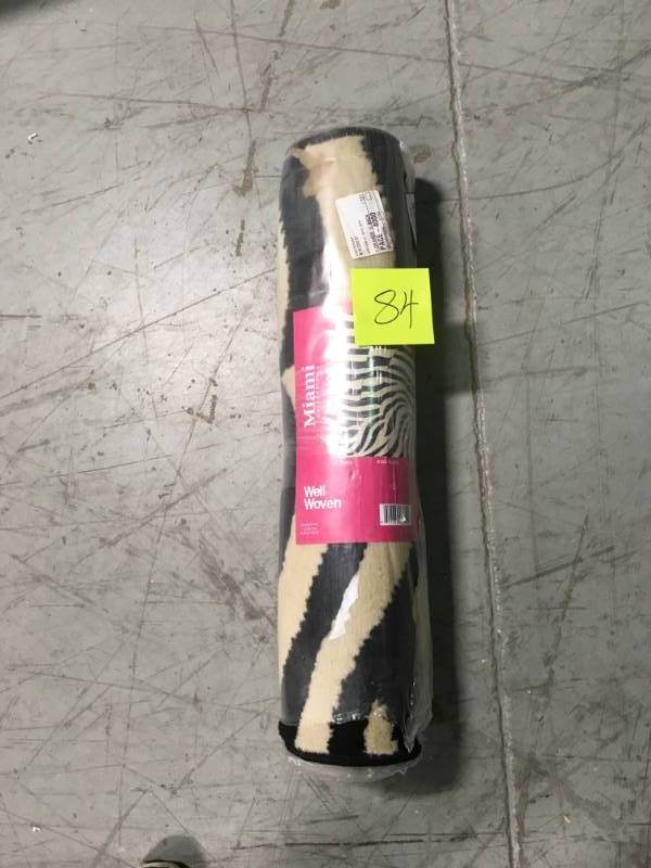 lot 84 image: Well Woven Miami Zebra Animal Print Stripe Black 2 ft. x 7 ft. Runner Rug not used