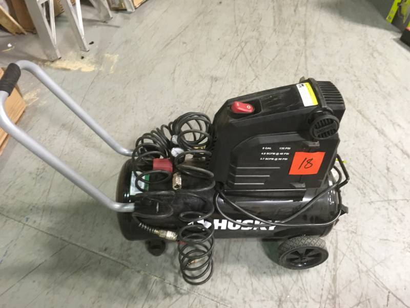 lot 18 image: Husky 8 Gal. Portable Oil Free Electric Air Compressor open box in like new condition