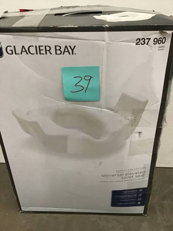lot 39 image: Glacier Bay Universal Elevated Toilet Seat in White 237 960 open box in like new condition