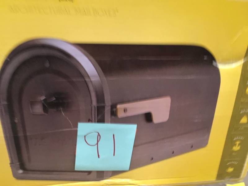 lot 91 image: Architectural Mailboxes Roxbury Post Mount Mailbox Rubbed Bronze with Premium Cast Aluminum Knob and Champagne Flag open box in like new condition