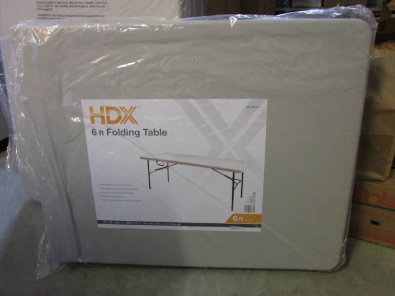 lot 128 image: HDX 6 ft Folding Table In plastic s...