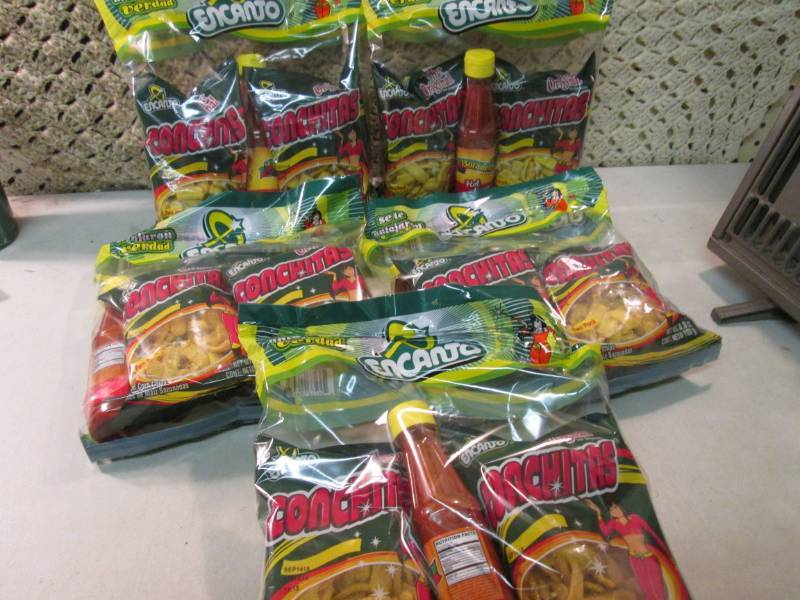 lot 228 image: 5 Packs of Conchitas with Bottle of...