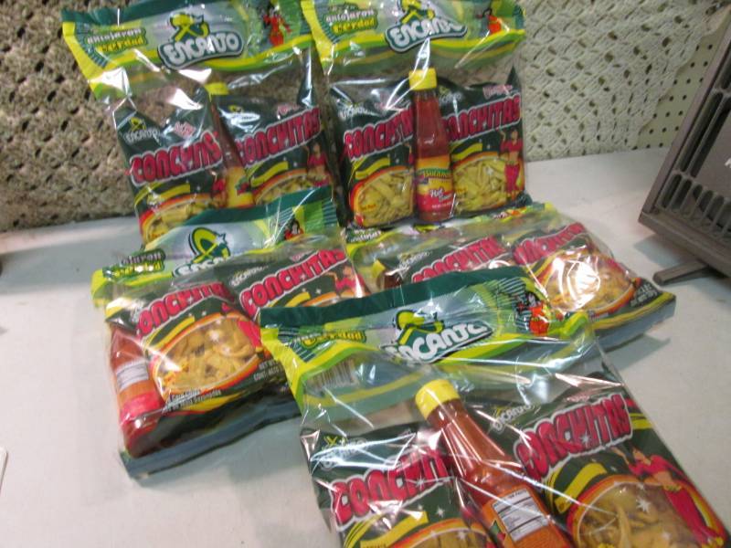 lot 229 image: 5 Packs of Conchitas with Bottle of...