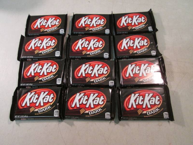 lot 231 image: 12 Kit Kat Dark Chocolate Candy Bar...