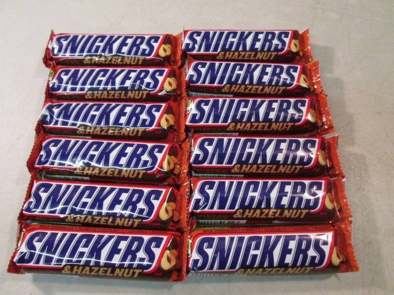 lot 258 image: 12 Snickers & Hazelnut Candy Bars B...