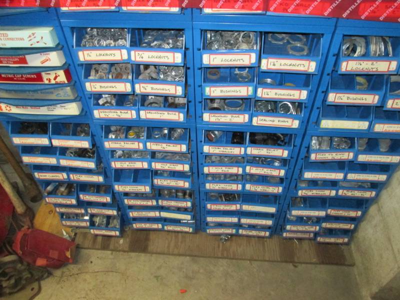 lot 113 image: Large display case lot of metal con...