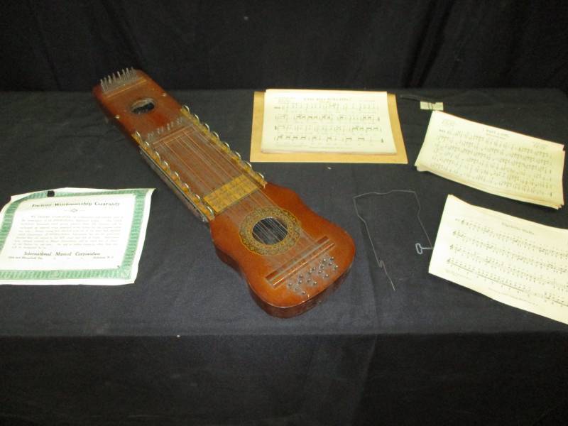 lot 11 image: Marx Violin-Uke in Remarkable condition with orig papers and sheet music