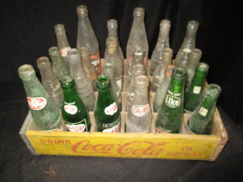 lot 69 image: Coca Cola Crate full of old bottles, some of bottom is bad