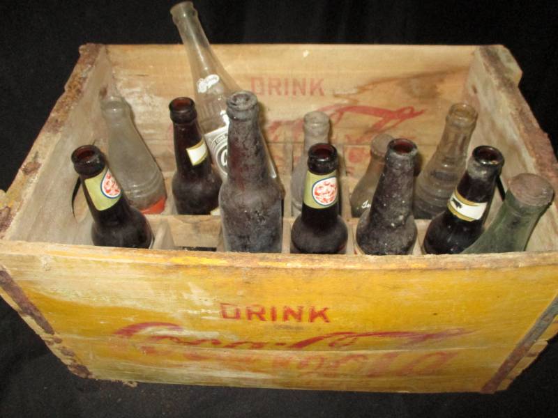 lot 70 image: Coca Cola Crate full of old bottles