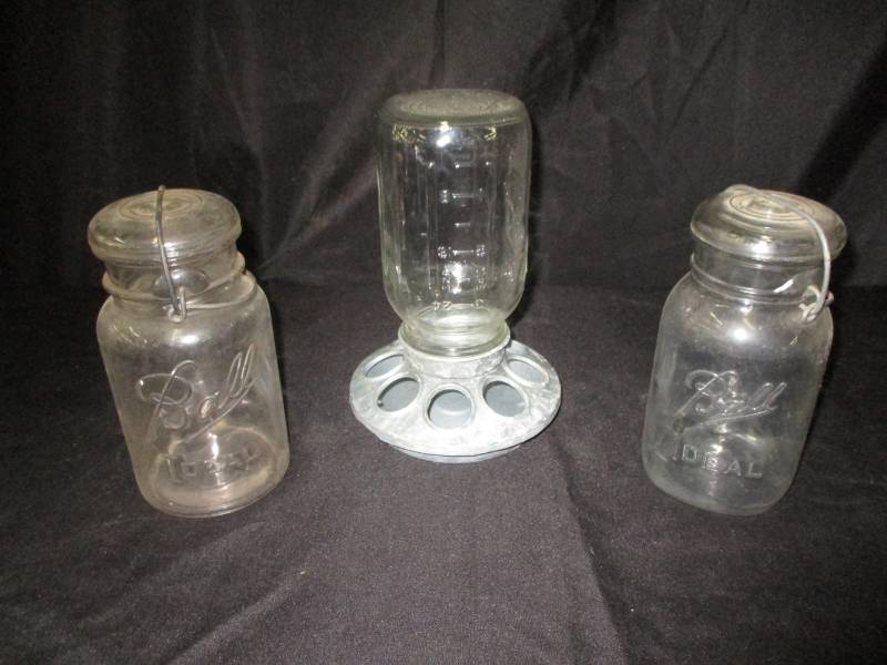 lot 147 image: 2 jars and a chicken feeder