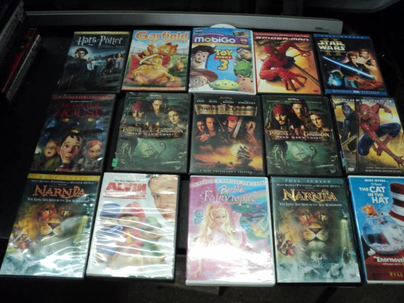 lot 216 image: Lot of 90 PG-13 DVDs see all pict...
