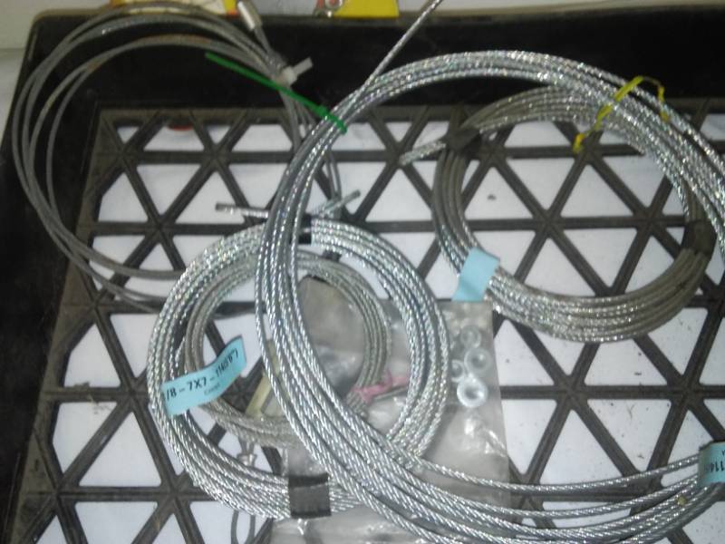 lot 108 image: Garage door locks and handle, cable and more. Mostly new.