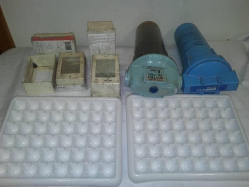 lot 110 image: Omni filter canisters, wiremoll electric boxes and fancy ice cube trays.