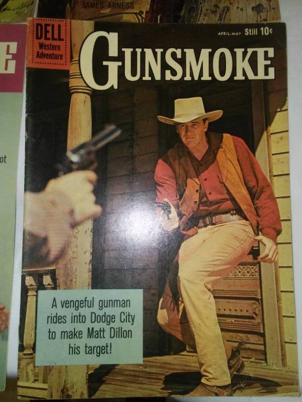 lot 246 image: 4 Gunsmoke Comics James Arness  good to excellent.