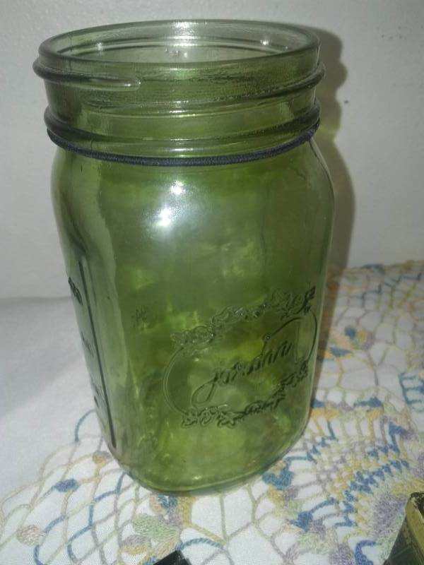 lot 221 image: Green and blue glass canning jars and more.