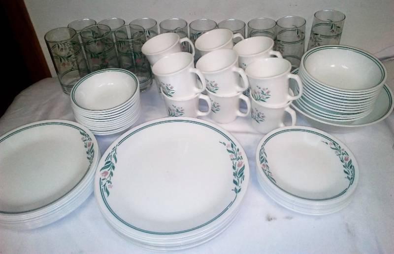 lot 231 image: Corelle dinnerware by Corning 85 pieces. 12 each dinner plate salad plate dessert plate large and small balls cops with matching glasses and one serving Bowl. Like new condition.