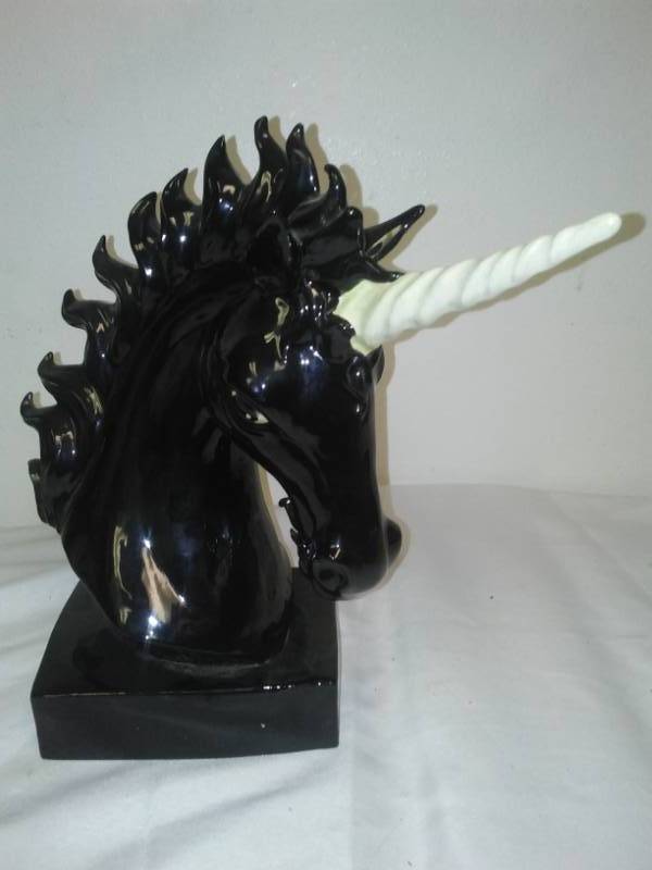 lot 310 image: Ceramic unicorn - black-and-white 12.5 in, note different eyes.