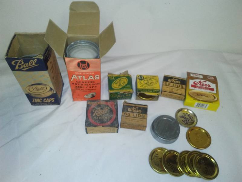 lot 313 image: Vintage canning jar lids in caps Atlas Boyd Mason zinc rubbers and more.