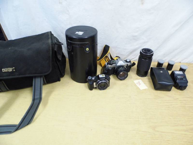 lot 38 image: Canon Camera - Sony Camera - Cases