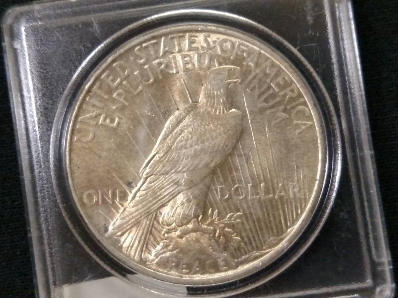 lot 23 image: 1925 BU Peace Silver Dollar...