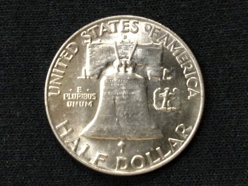 lot 59 image: 1957 AU Franklin Silver Half Dollar...