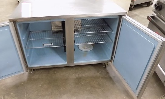 lot 15 image: Delfield, Mod #UC4148, two door under counter freezer, NSF, SN 1306152001676, caster mounted, 5.6 amps.Runs Freezes