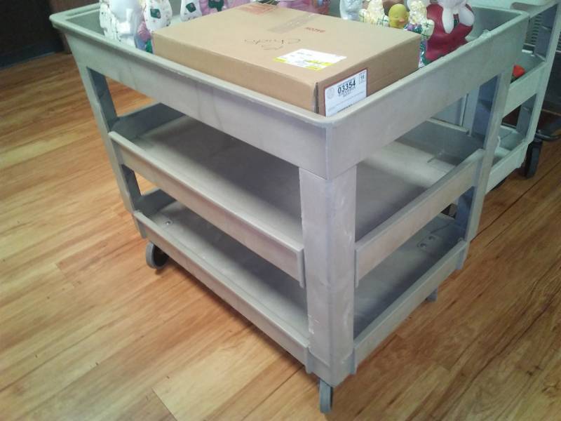 lot 56 image: Resin 3-shelf roller cart with Angel contents