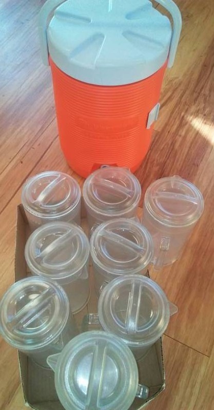 lot 74 image: Rubbermaid orange cooler with serving pitchers - 8.
