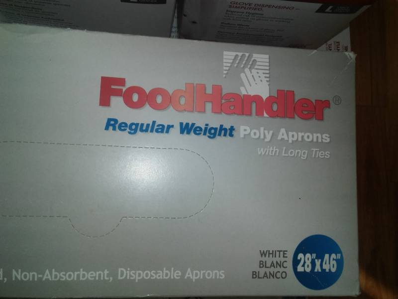 lot 79 image: Food Service sanitary gloves, aprons, hair nets and more.
