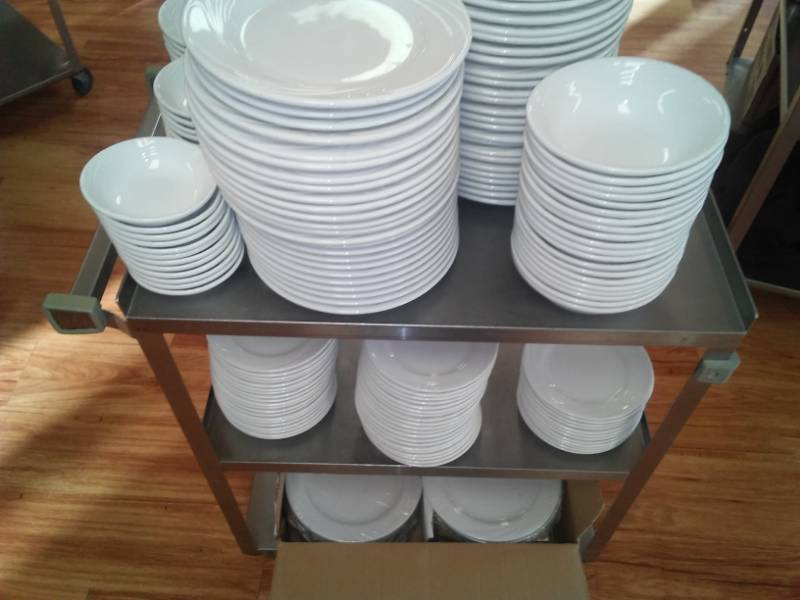 lot 85 image: Used and New white china dinnerware plus roller cart