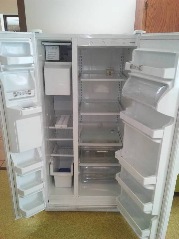 lot 219 image: Kenmore side-by-side refrigerator freezer.