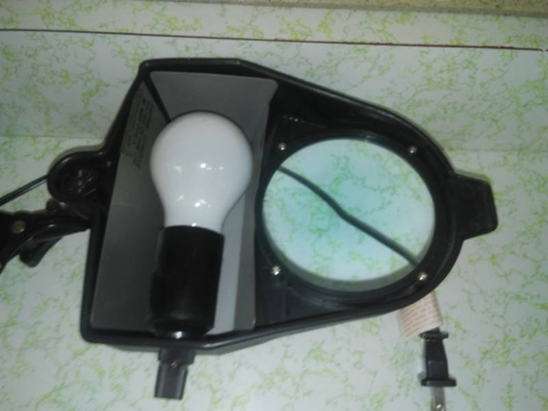 lot 245 image: Magnifiers, clock, tripod.