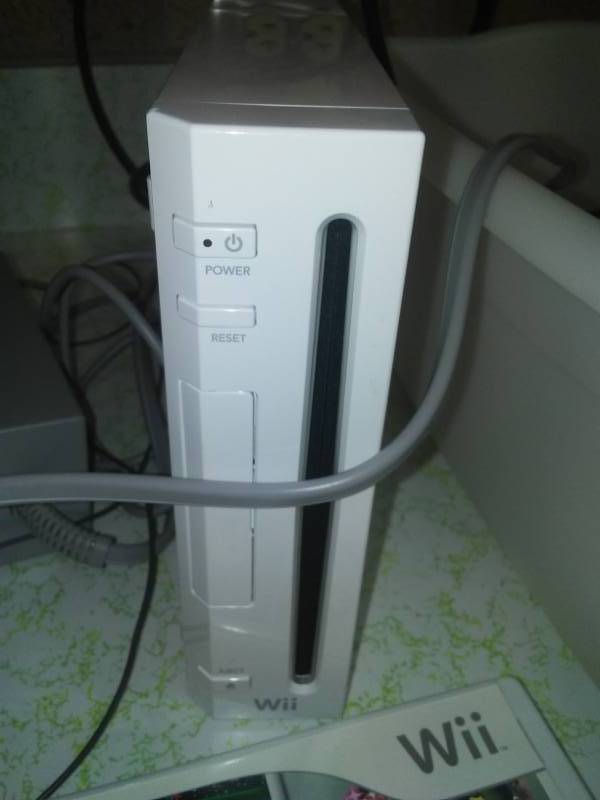 lot 248 image: Wii game system untested complete with chargers and controllers and more.