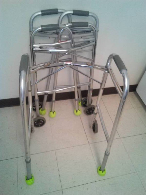 lot 123 image: 3 Carex Walkers with wheels and tennis balls.