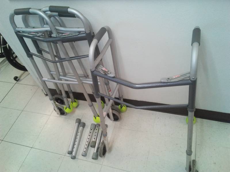 lot 384 image: 3 aluminum fold up walkers.